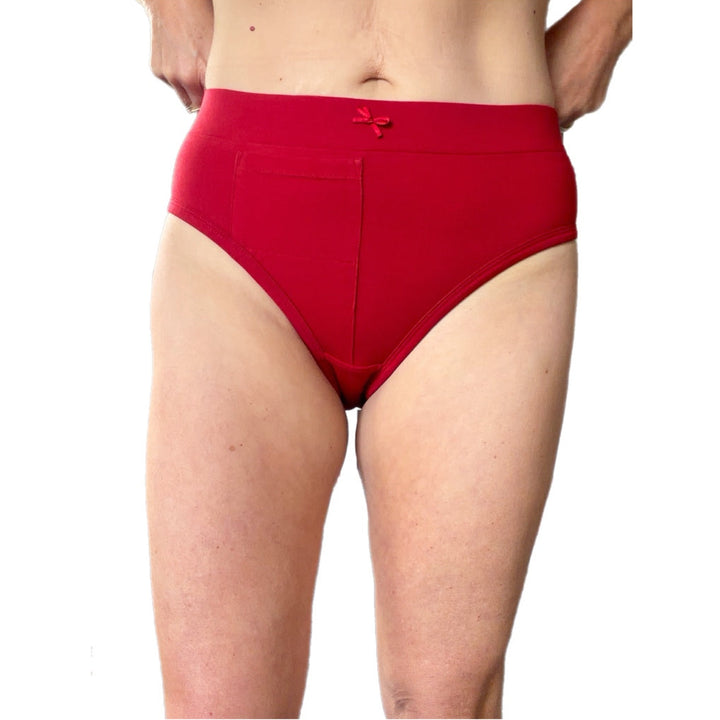 A person wearing bright red bikini-style underwear, shown from the waist to upper thighs against a plain white background.