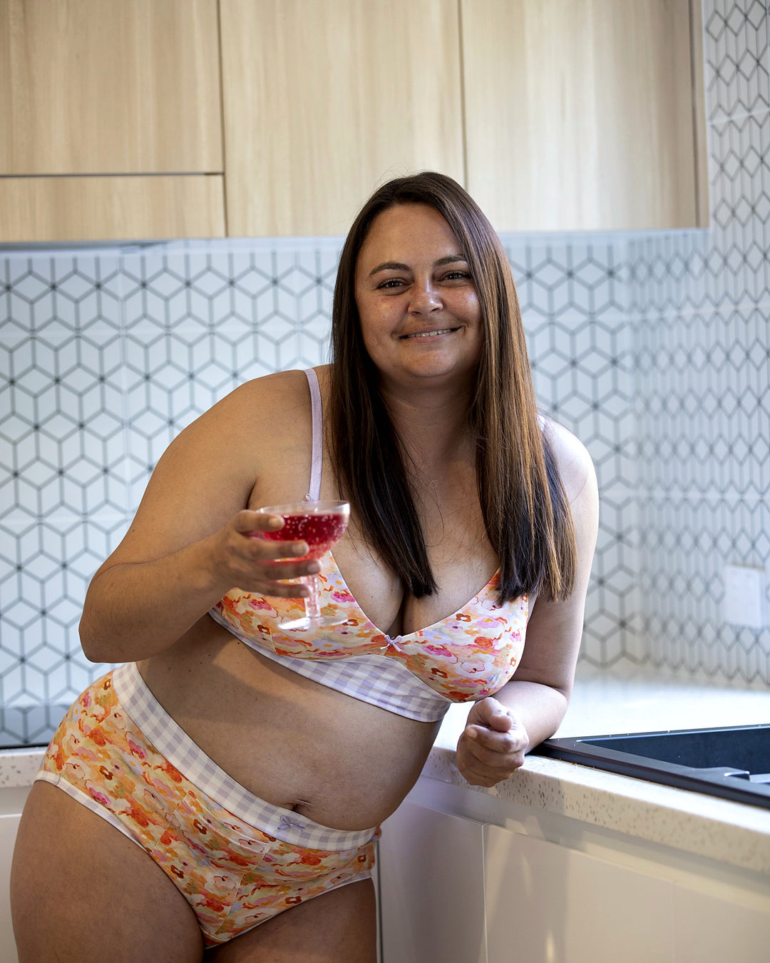 Woman wearing Little Lola wirefree bralette and briefs in her kitchen