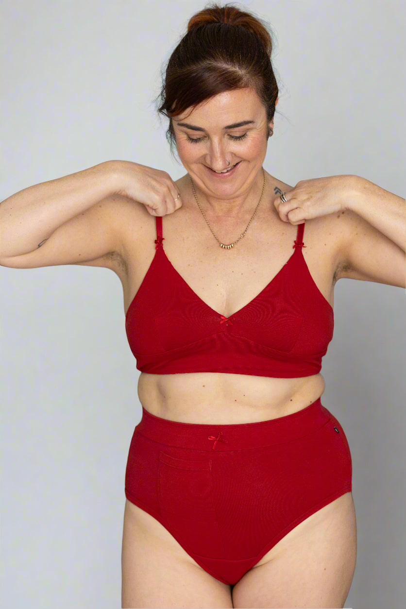 woman wearing red bralette and matching discharge underwear