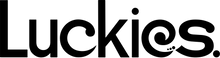 The word Luckies in black lettering. The "e" is shaped like a spiral with three small dots near the tail of the "e".